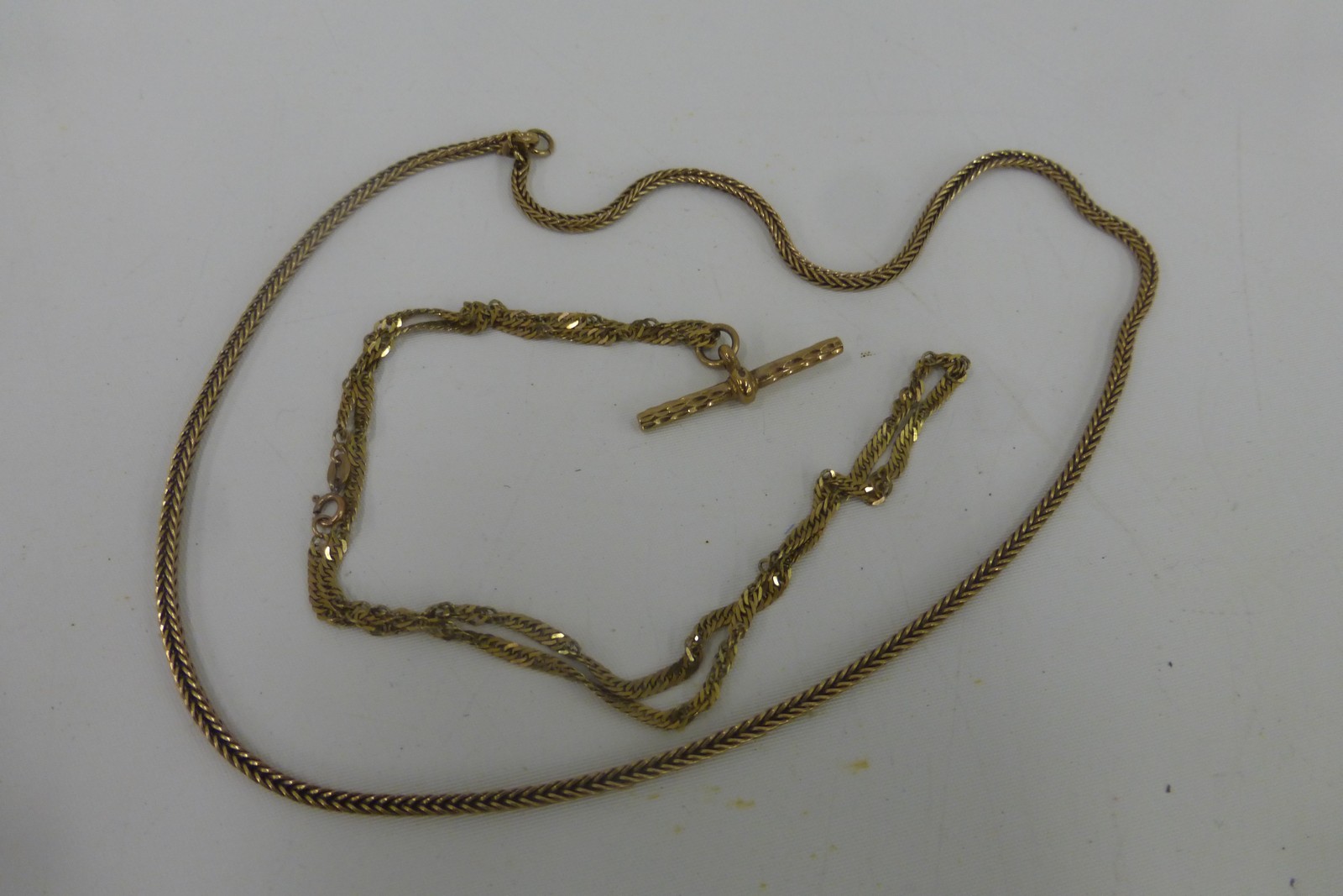 Two 9ct gold chains, weight 12g.