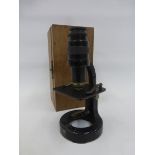 A cased C. Baker of London, microscope number 15698.