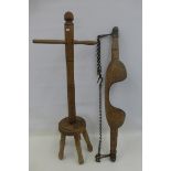 A 19th Century wooden milk maid's yoke and a 19th Century wash dolly.
