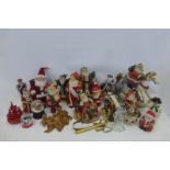 A collection of Christmas related figures including musical snow globes.