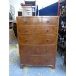 An Edwardian inlaid mahogany bow fronted chest of five drawers, raised on shaped bracket supports.