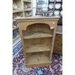 A pine open corner wall hanging set of shelves.