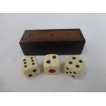 A 19th Century mahogany and leather clad dice box with sliding lid, complete with three ivory dice.