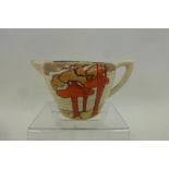 A small Clarice Cliff Newport Pottery Bizarre milk jug in the Coral Firs pattern, good condition.