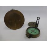 A 19th Century brass cased compass and a WWI brass standing barometer, stamped Negretti & Zambra,