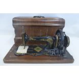 A Jones Family sewing machine with a parquetry inlaid wooden case.