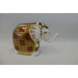 A Royal Crown Derby elephant paperweight, gold stopper.