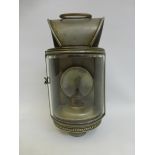 A 19th Century ship's lantern with curved glass frontage and slip on bracket, the burner stamped L.
