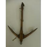 A brass folding miniature anchor in excellent condition, unknown maker.