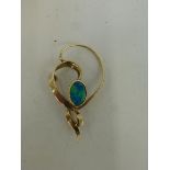 A 9ct gold brooch set with an ocean blue opal.