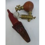 An unusual scientific/medical brass, glass and rubber instrument, and a leather cased set of
