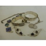 An assortment of silver jewellery including bracelets, a silver Albert chain etc.