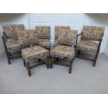 A set of six (four plus two) oak dining chairs with floral upholstered seats and backs.