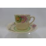 A Clarice Cliff Wilkinson Pink Pearl pattern cup and saucer.