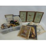 A box of mixed collectables including a silk painting depicting butterflies, postcards, coins a