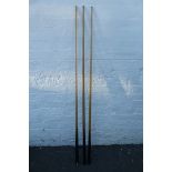 Three assorted snooker cues, an E.J. Riley Ltd makers Accrington "The Riley Cue", a special cue made