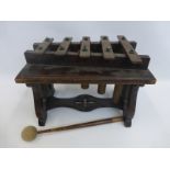 An Edwardian oak framed table top dinner GLOCKENSPIEL gong with lyre end supports.