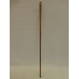 A 19th Century walking cane with Regency style gilt decorated knop with eyelets.