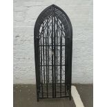 A Gothic style metal wine rack for thirty eight bottles enclosed with two doors.
