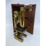 A mahogany cased R. & J. Beck Ltd, London brass microscope No. 29256 with carrying handle.