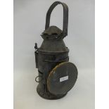 An antique style railway signal lamp.