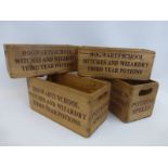 A set of four miniature wooden crates inscribed Hogwarts School Witches and Wizardry Third Year
