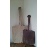 A large Victorian elm bread peel together with another.