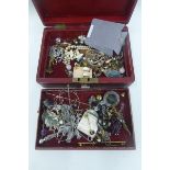 A jewellery box with an assortment of costume jewellery including silver, mother of pearl etc.