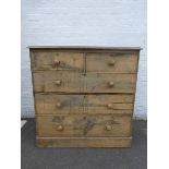 A Victorian pine chest of two short over three long graduated drawers, raised on a plinth base.