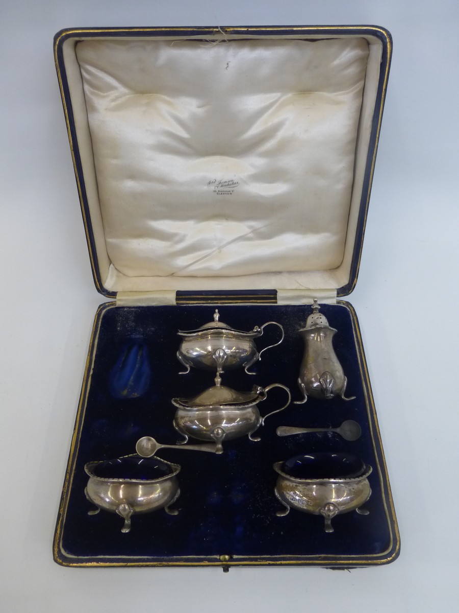 A cased six piece silver condiment set (one shaker missing), maker E.S Barnsley & Co. (Edward Souter