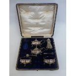 A cased six piece silver condiment set (one shaker missing), maker E.S Barnsley & Co. (Edward Souter