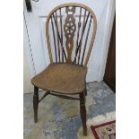 A 19th Century wheelback elm seated chair and an ebonised plant stand with undertier.