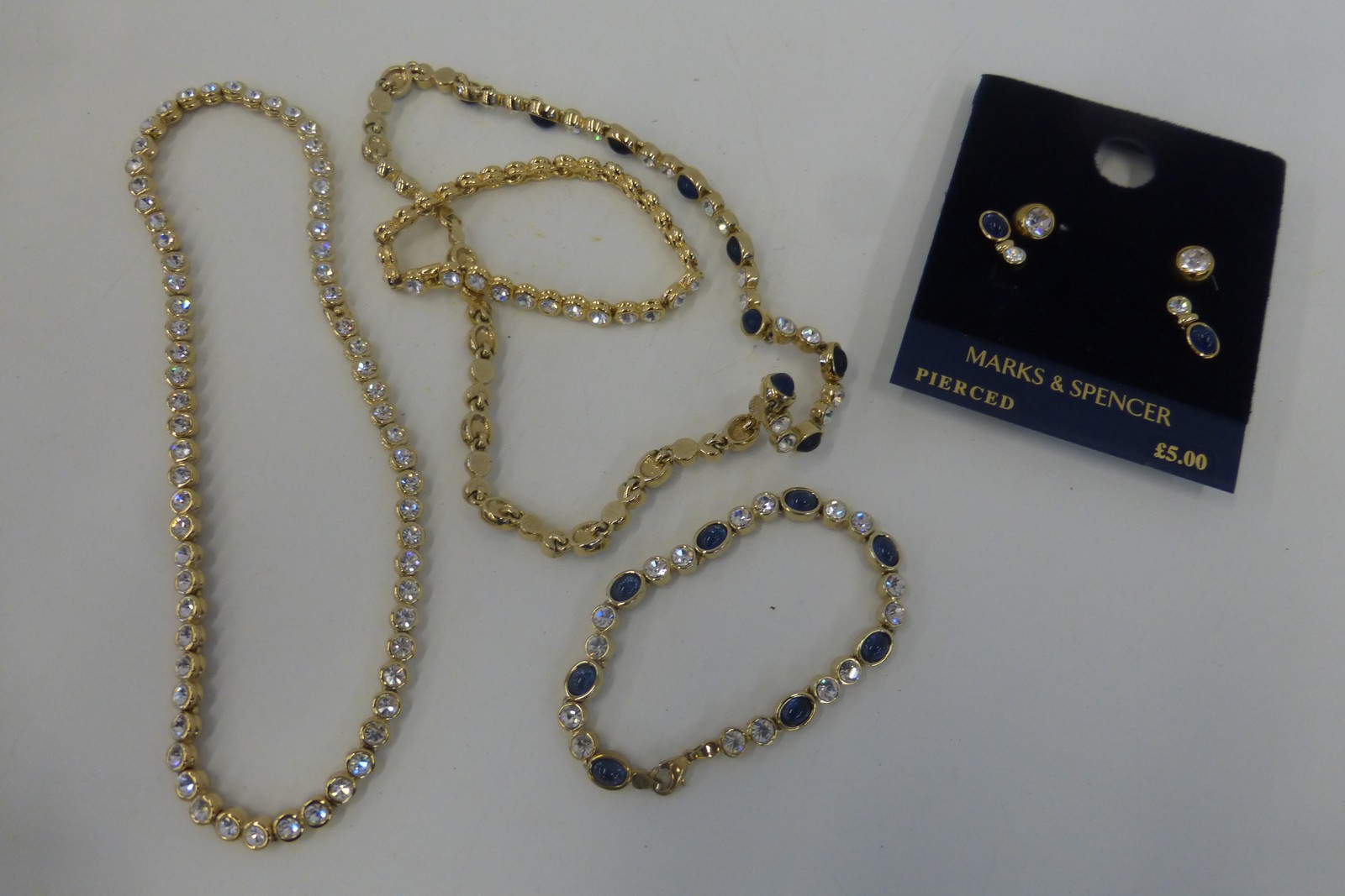 Two sets of costume jewellery comprising a pair of earrings, a bracelet and a necklace.