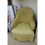 A late Victorian upholstered tub chair.