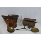A large Victorian copper helmet shaped coal scuttle and two 19th Century pierced brass and iron