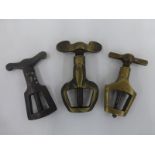 Three hand held brass drill bits, one stamped Eaves Reg.