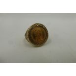 A 9ct gold ring set with a 1982 half sovereign, total weight 7.9g.
