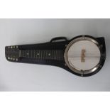 A cased banjo ukelele.