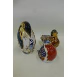 A Royal Crown Derby robin, gold stopper, a mallard duck and a penguin both silver stoppers.