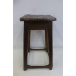 A country elm and pine stool with worn stretchers, stamped under seat for L & NWR Co, London and