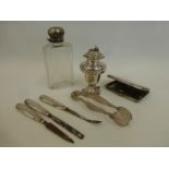 An assortment of silver including a three piece manicure set, a cigarette case etc.