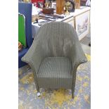 A Lloyd loom bedroom elbow chair.