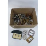 A box of assorted costume jewellery including brooches, necklaces etc.