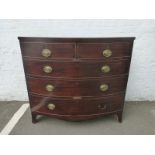 A George III mahogany bow fronted chest of two short over three long drawers.