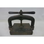 A Victorian heavy press with butterfly handle.