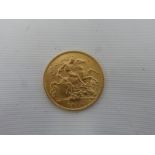A 1914 gold half sovereign.