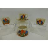 Four oieces of Clarice Cliff Newport and Wilkinson Bizarre Crocus pattern table ware, cup and