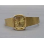 A 1960s 9ct gold lady's Rotary wistwatch set with four diamonds and a 9ct gold strap, weight 30.9g.
