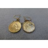 A pair of 1982 half sovereign earrings set in 9ct gold mounts.