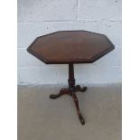 A mahogany octagonal topped tripod wine table.